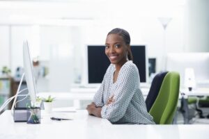 Premium Photo _ She finds her work very rewarding Shot of a young businesswoman sitting at a desk